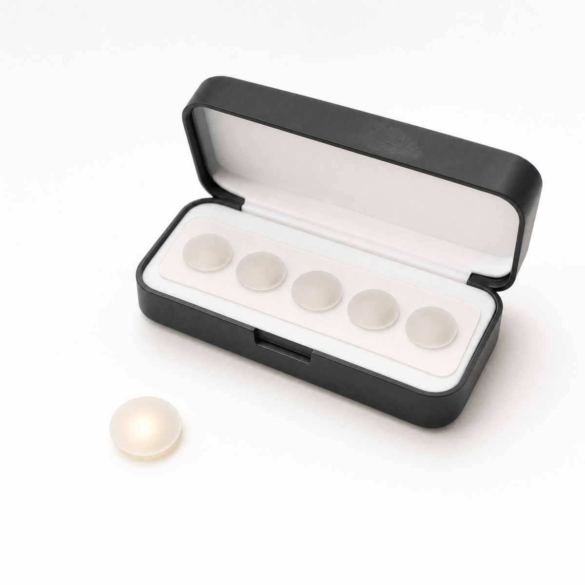 The open Lit Dots case with a glowing dot beside it